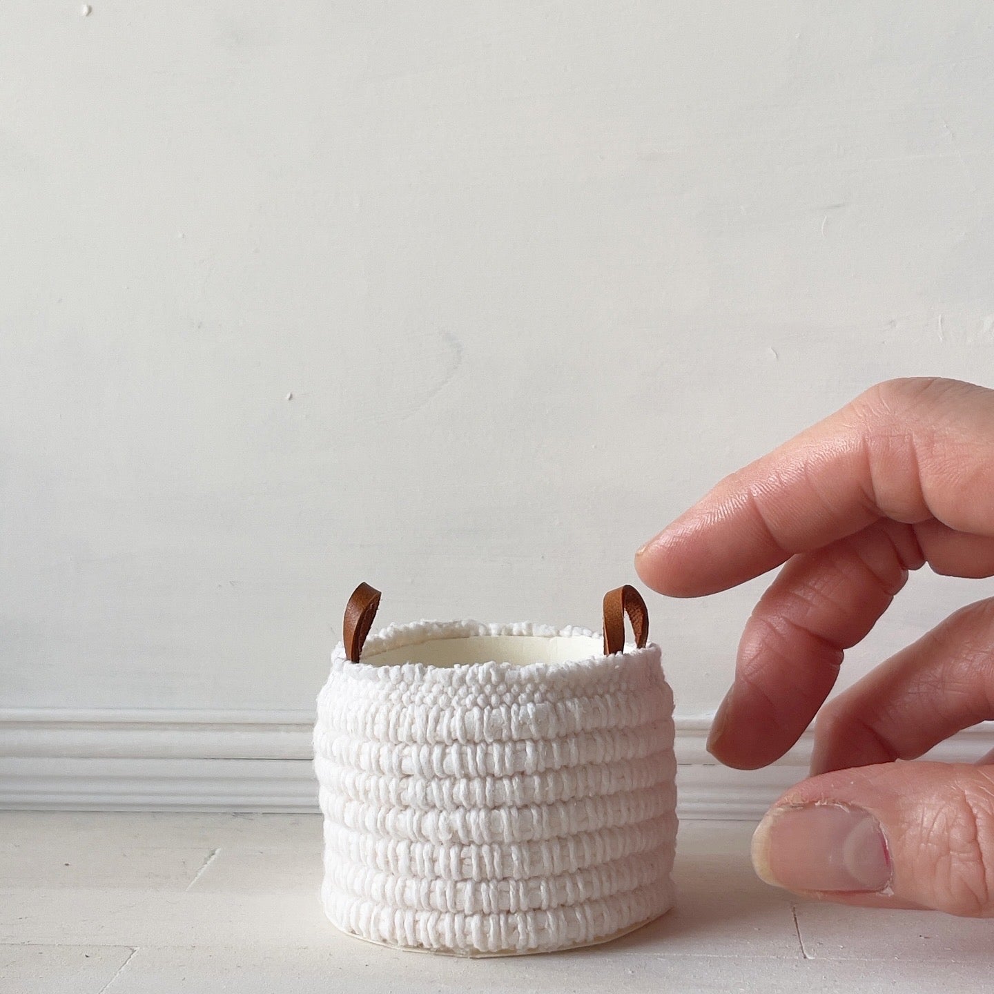 White woven blanket basket