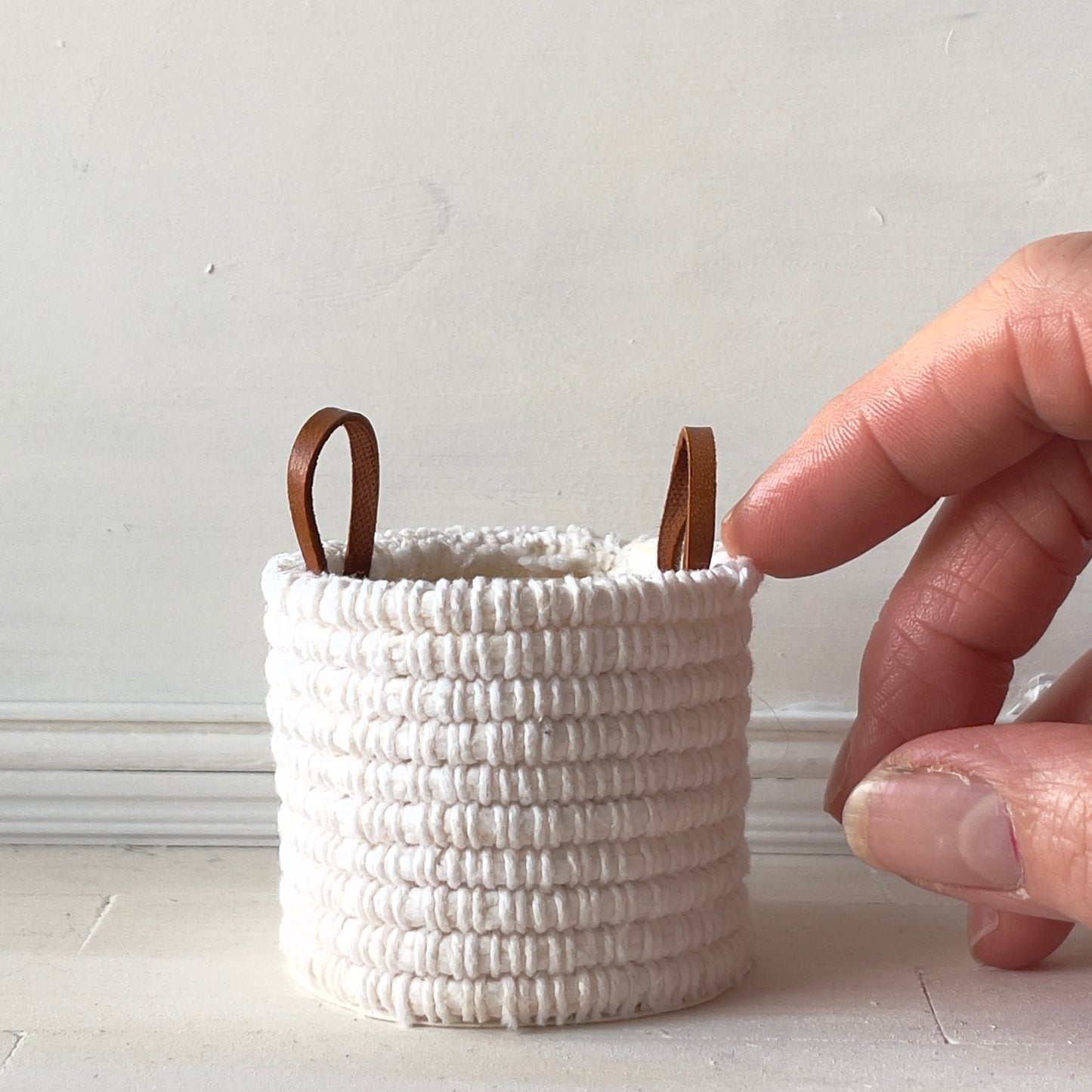 White woven blanket basket